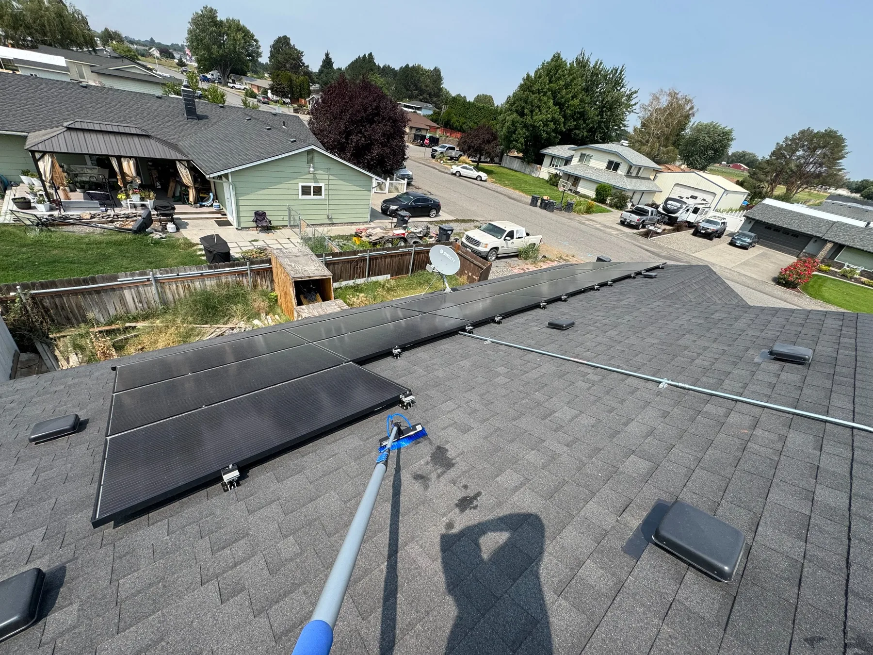 Solar panel cleaning equipment on a residential rooftop in the Tri-Cities Washington